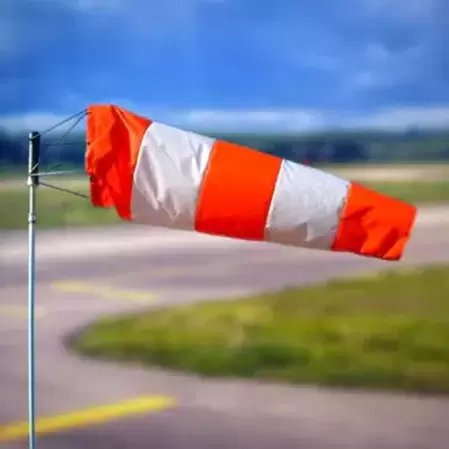 orange white windsock in a pole 